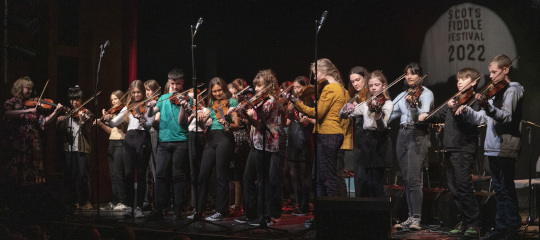 The Youth Engagement Programme on stage with Patsy Reid